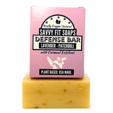 A box of Savvy Fit Soaps Defense Bar in Lavender Patchouli with an open soap, highlighting its plant-based, USA-made, and calming skincare formula.
